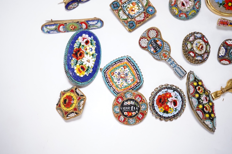 A collection of twenty-eight micro-mosaic brooches, including ten banjo and guitars shaped brooches, six similar large oval brooches, nine small brooches and three long brooches. (28) Condition - good
